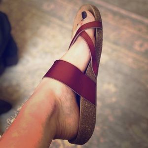 Brown leather slip on strap sandals.